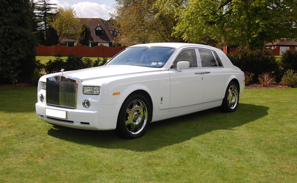 White Phantom style wedding car parked up